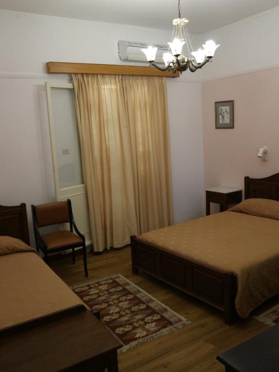 Postel nebo postele na pokoji v ubytování Acropolis House