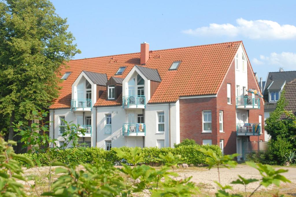 a row of houses with red roof at FeWo 7 im "Haus am Meer" in Boltenhagen