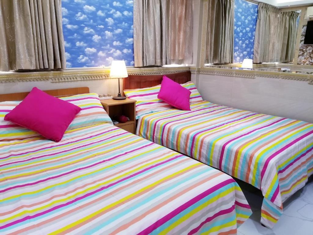 Ένα ή περισσότερα κρεβάτια σε δωμάτιο στο LongWin Hostel