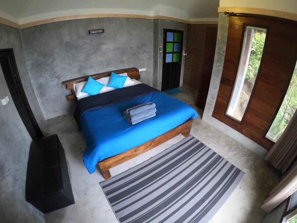 Postel nebo postele na pokoji v ubytování Blue Heaven Resort Koh Tao