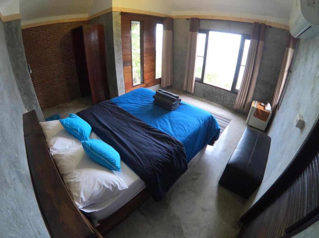 Postel nebo postele na pokoji v ubytování Blue Heaven Resort Koh Tao