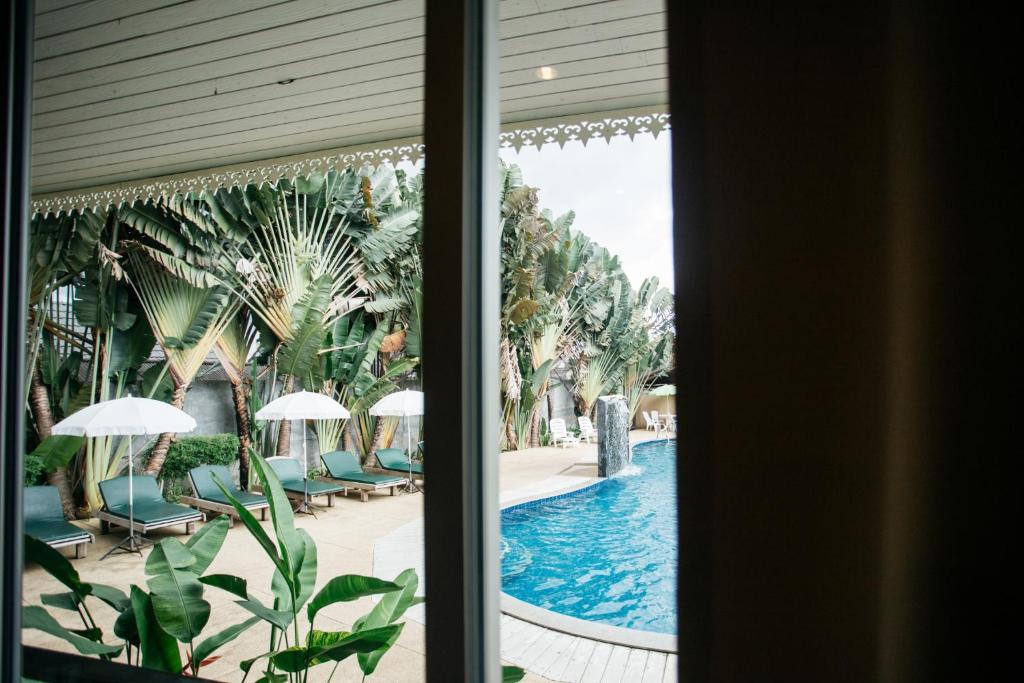 Bazén v ubytování Diamond Park Inn Chiangrai & Resort nebo v jeho okolí