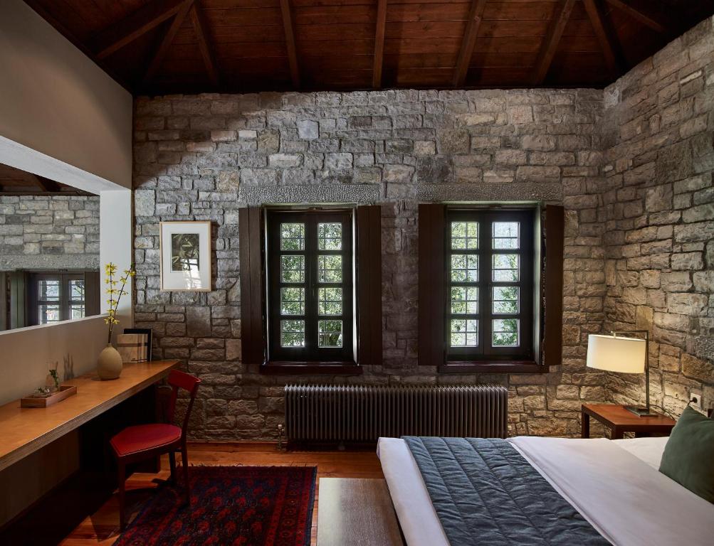 Postel nebo postele na pokoji v ubytování Aristi Mountain Resort
