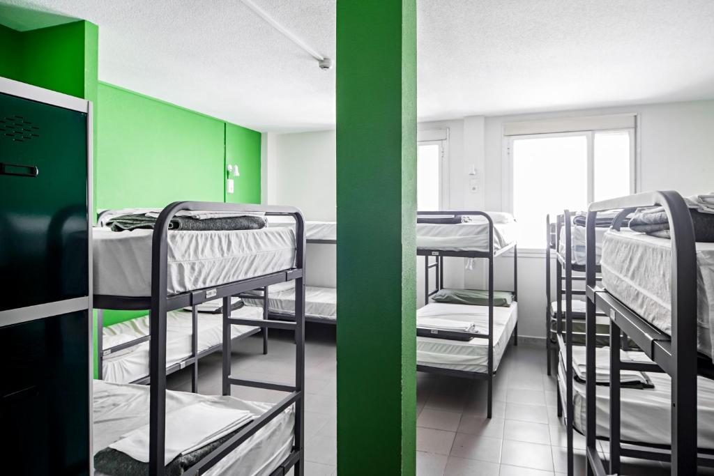 Postel nebo postele na pokoji v ubytování Motion Chueca Hostel