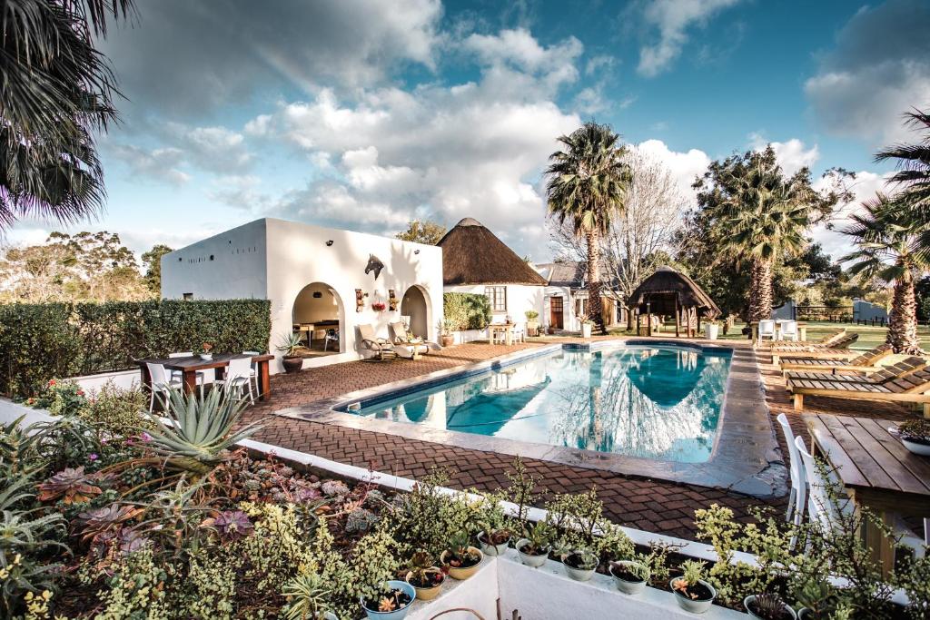 an image of a house with a swimming pool at Bella Manga Country Escape in Plettenberg Bay