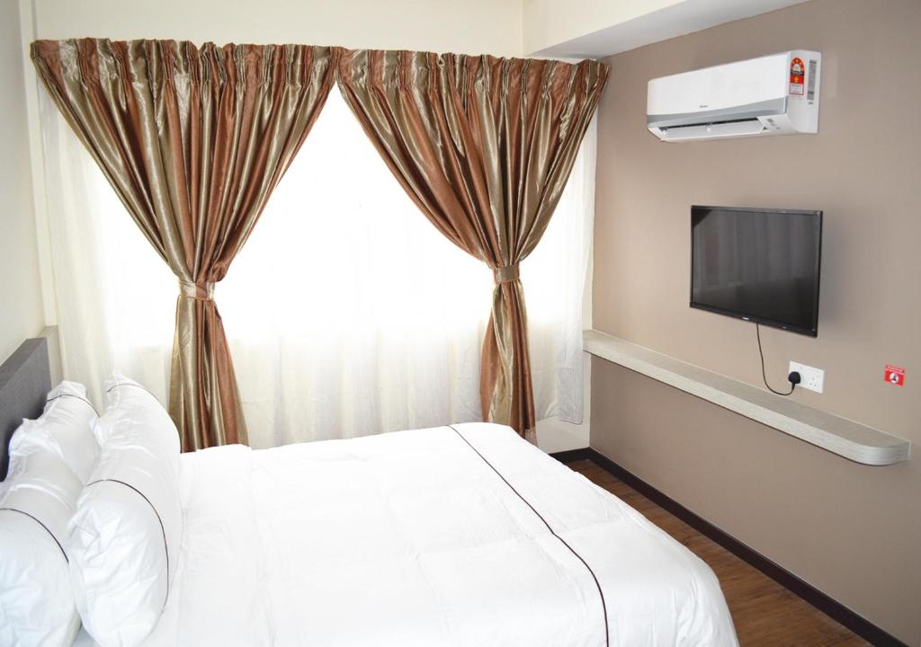 TV a/nebo společenská místnost v ubytování Angsoka Hotel