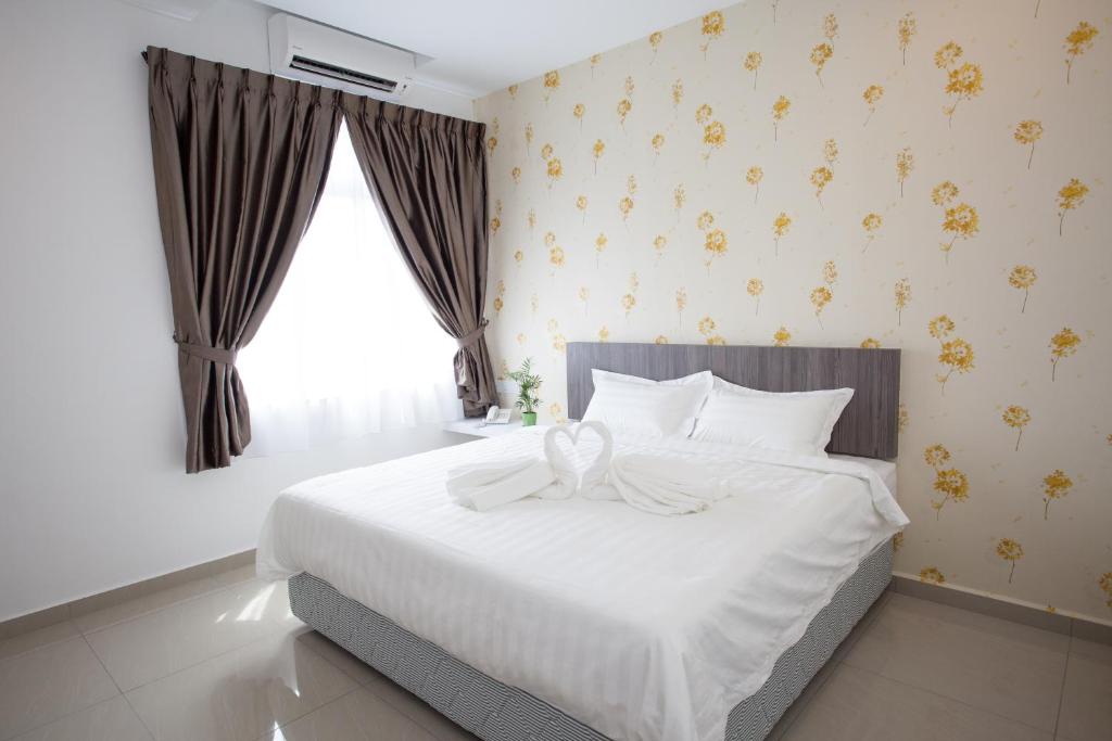 Postel nebo postele na pokoji v ubytování Twenty Nine Hotel