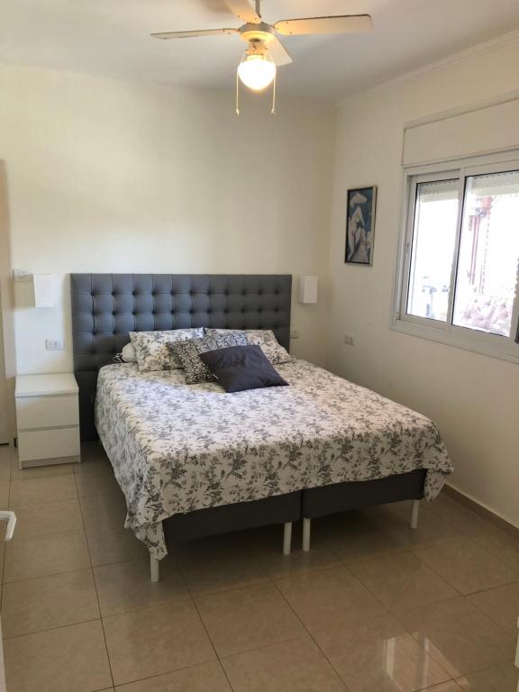 a bedroom with a large bed in a room at View House in Eilat