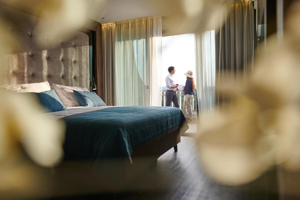 Postel nebo postele na pokoji v ubytování Postojna Cave Hotel Jama