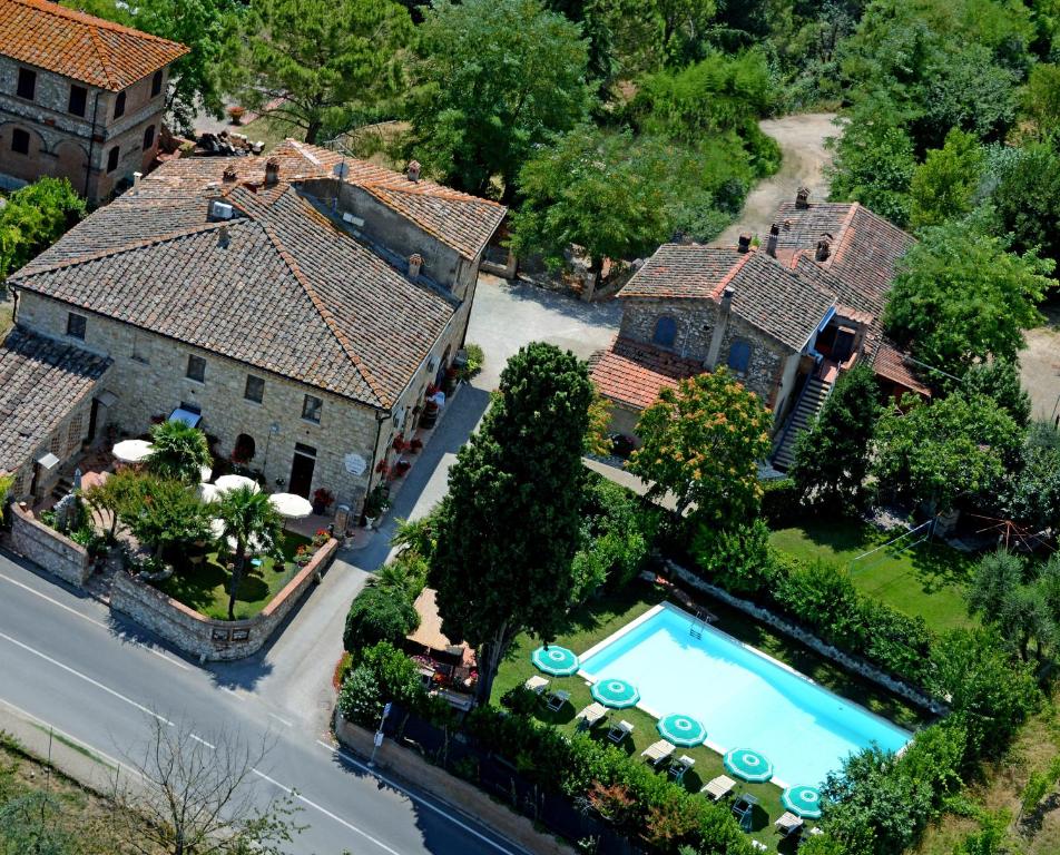 an aerial view of a house with a swimming pool at Bed & Breakfast Casale Gregoriano and Apartaments in San Gimignano