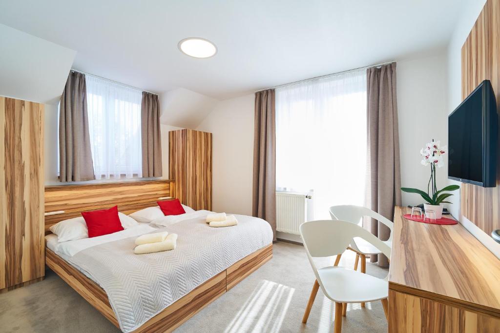 
Postel nebo postele na pokoji v ubytování Penzion Fino -club
