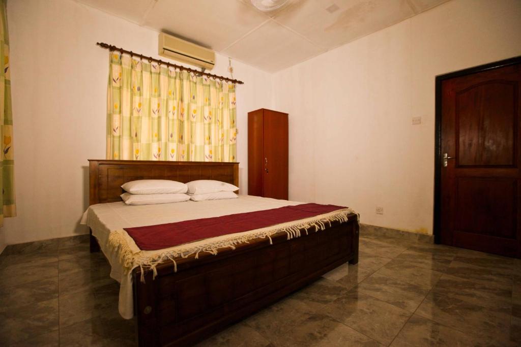 HOSTEL KATUNAYAKE At COLOMBO AIRPORT TRANSITにあるベッド