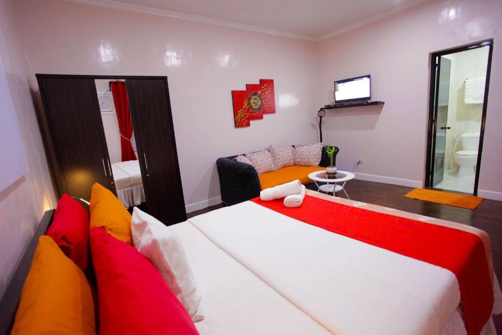 Postel nebo postele na pokoji v ubytování HalfWay House Hostel Mactan Cebu Airport
