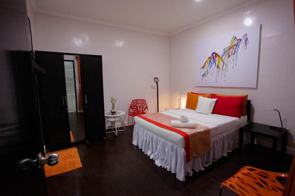 Postel nebo postele na pokoji v ubytování HalfWay House Hostel Mactan Cebu Airport
