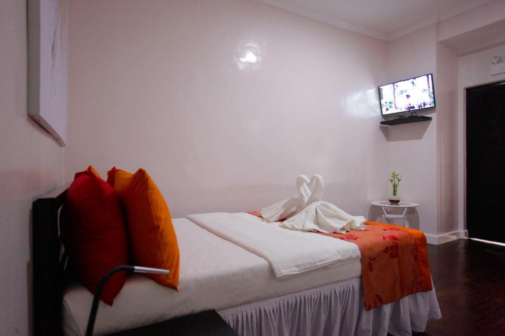 Postel nebo postele na pokoji v ubytování HalfWay House Hostel Mactan Cebu Airport