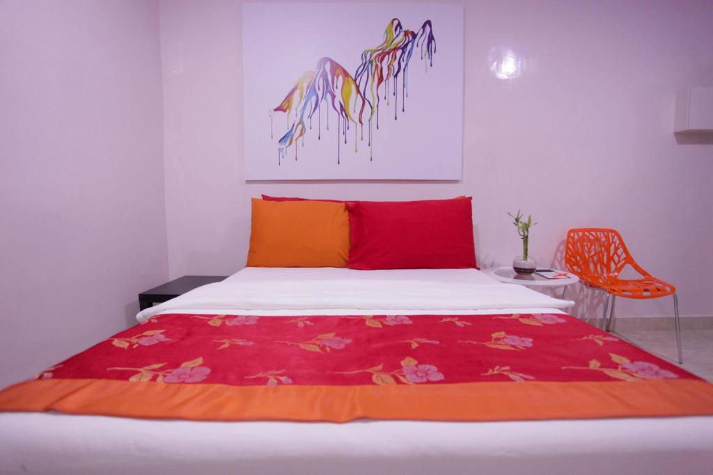 Postel nebo postele na pokoji v ubytování HalfWay House Hostel Mactan Cebu Airport