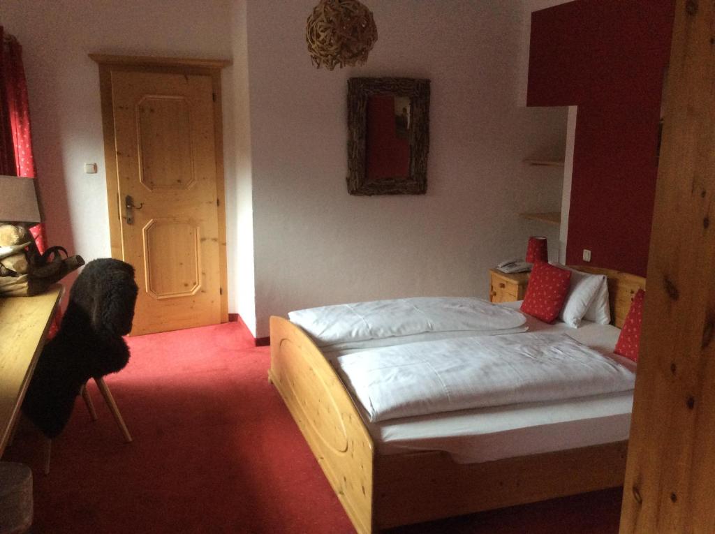 Postel nebo postele na pokoji v ubytování Hotel Gamshof