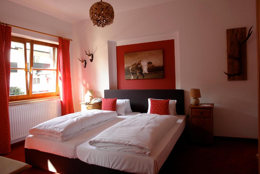 Postel nebo postele na pokoji v ubytování Hotel Gamshof