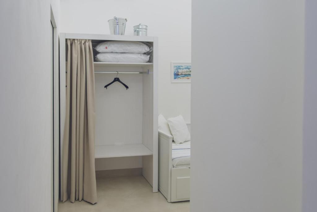 Łóżko lub łóżka w pokoju w obiekcie CASA MELIO'