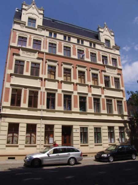 a building with a car parked in front of it at Am Pontepark in Görlitz