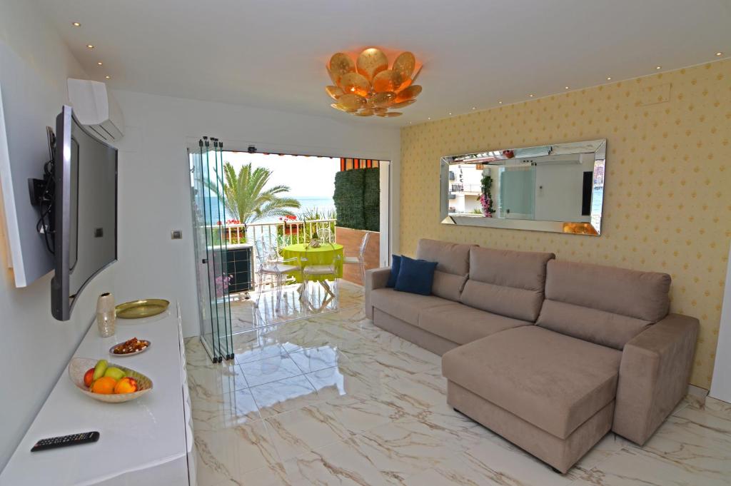 a living room with a couch and a table at Apartamento Daniela in Benidorm