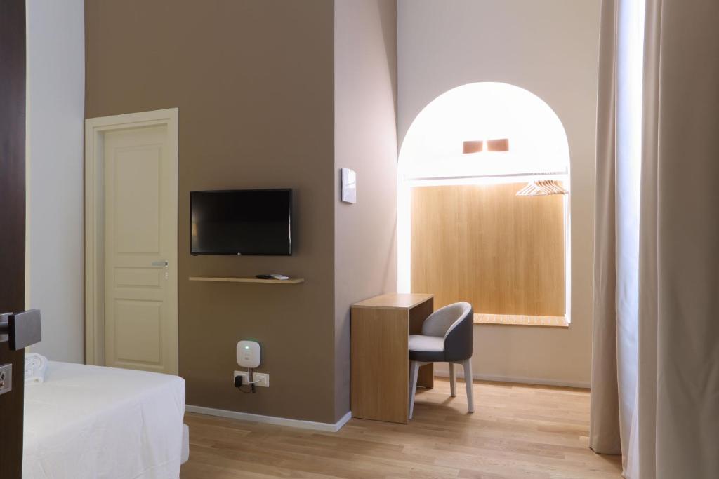 Televízia a/alebo spoločenská miestnosť v ubytovaní B&B Castanea