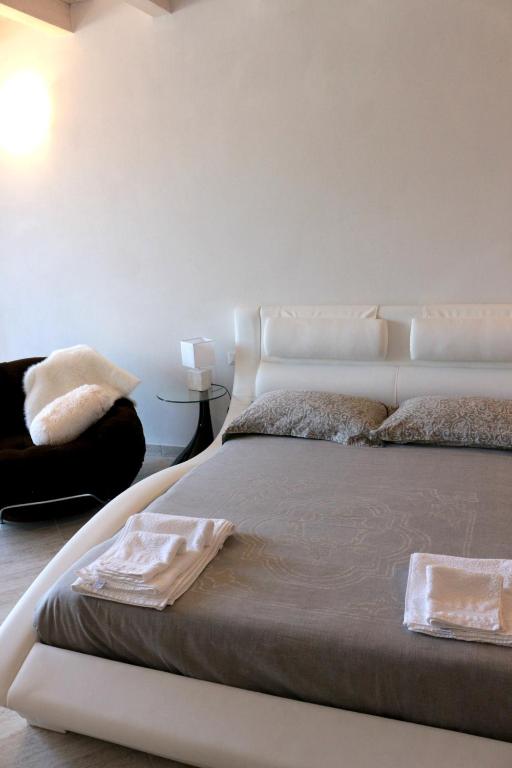 Postel nebo postele na pokoji v ubytování Paradeisos Residence Sas