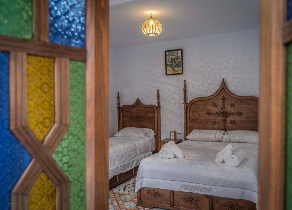 Una cama o camas en una habitación de dar solaiman