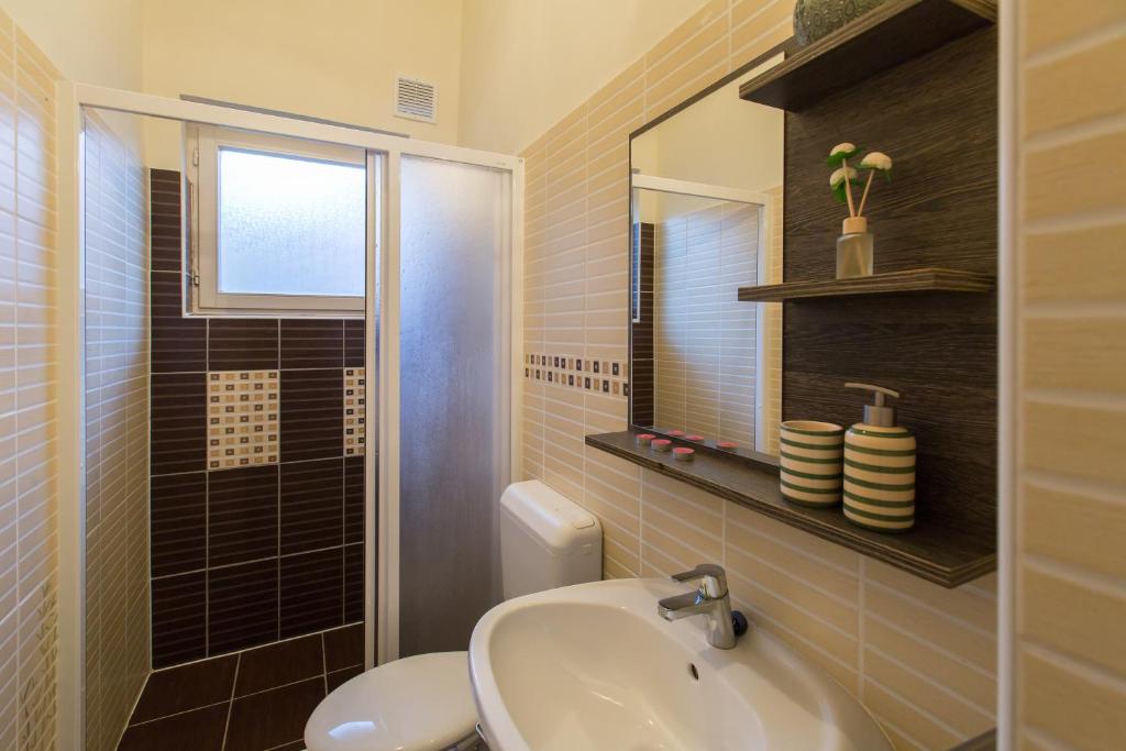 Kúpeľňa v ubytovaní Holiday House Siófok