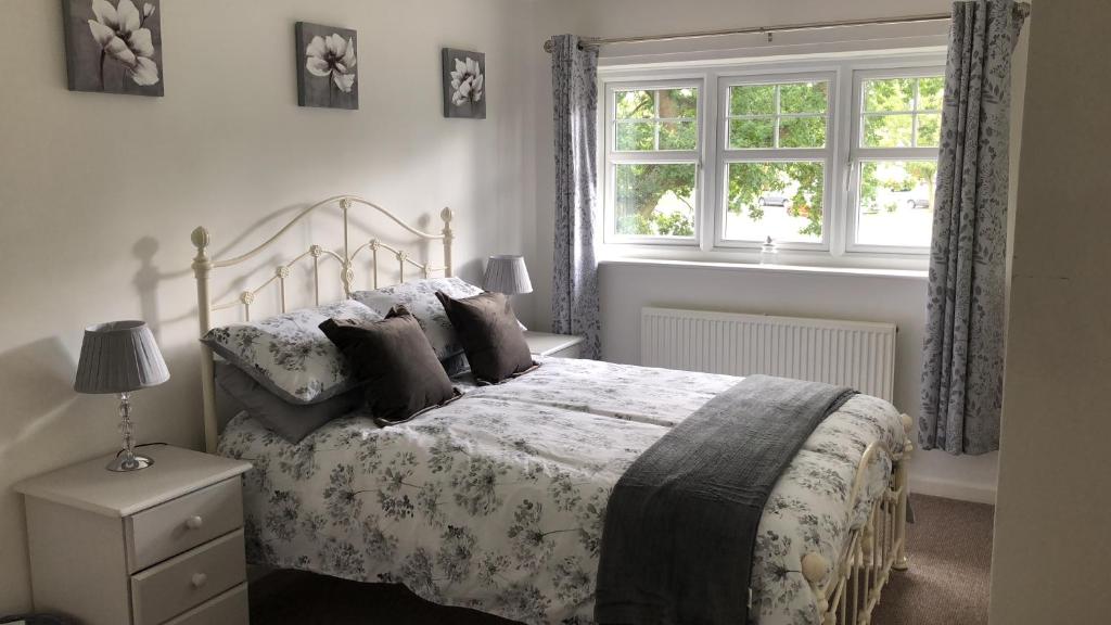 a bedroom with a bed and a window at 1 Silkin Serviced Accommodation in Newton Aycliffe