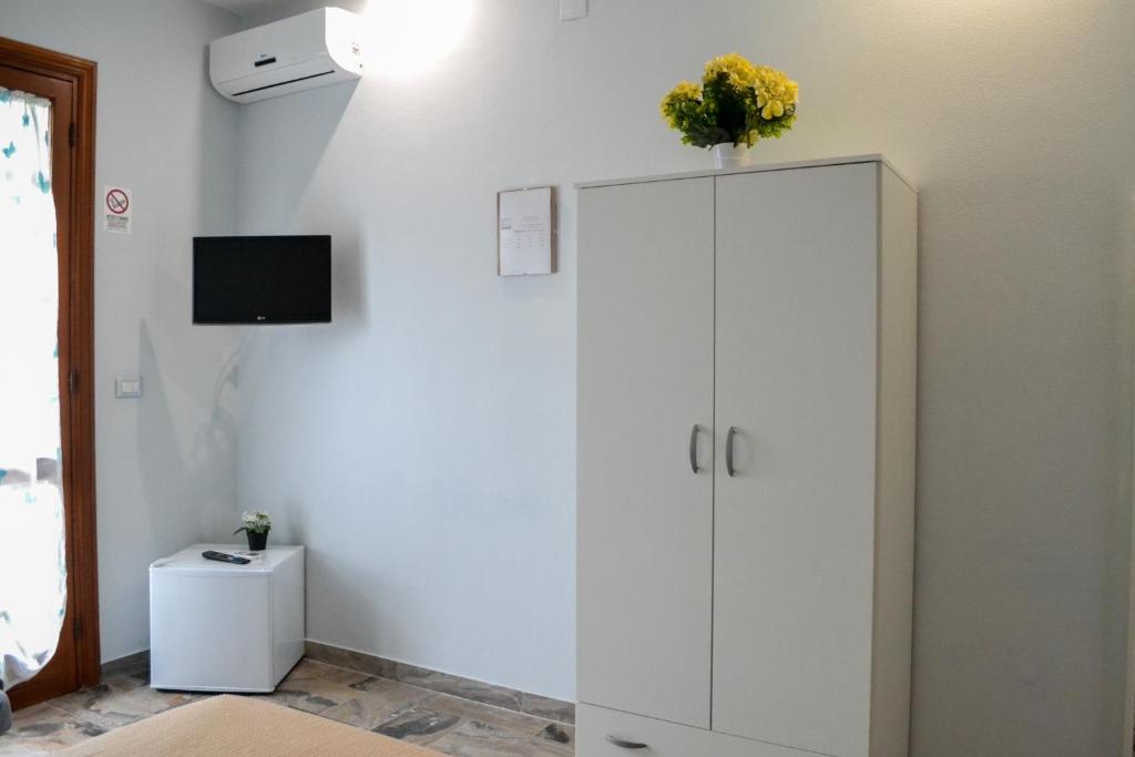 Televízia a/alebo spoločenská miestnosť v ubytovaní Pompei Gryllus