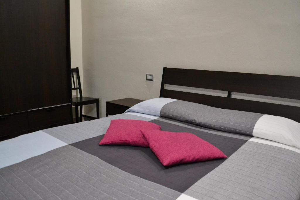Posteľ alebo postele v izbe v ubytovaní Pompei Gryllus