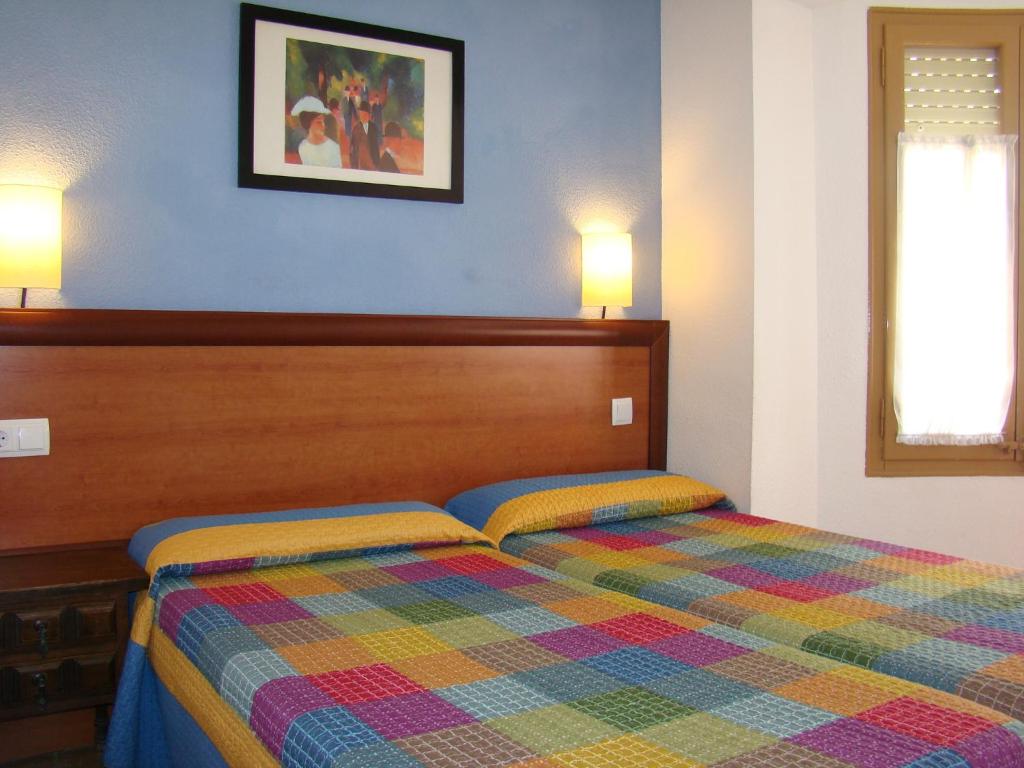 Postel nebo postele na pokoji v ubytování Hostal Platja