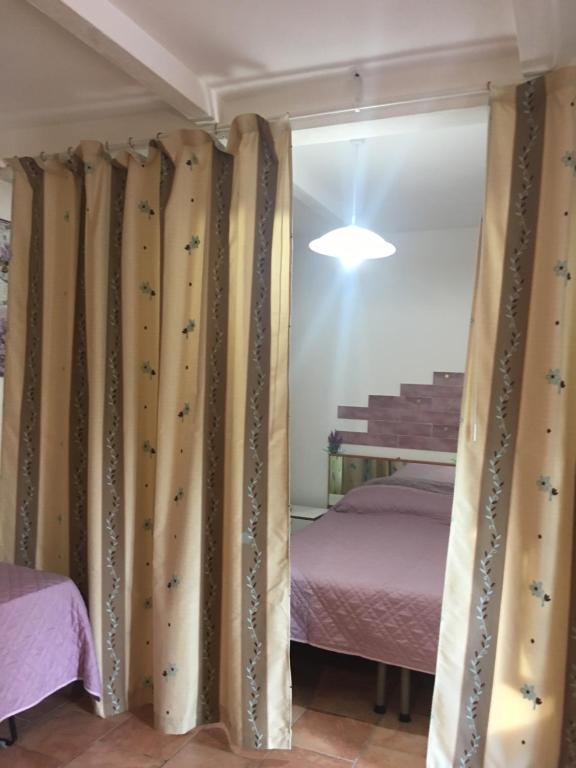 A bed or beds in a room at Agriturismo Fattoria del Colle
