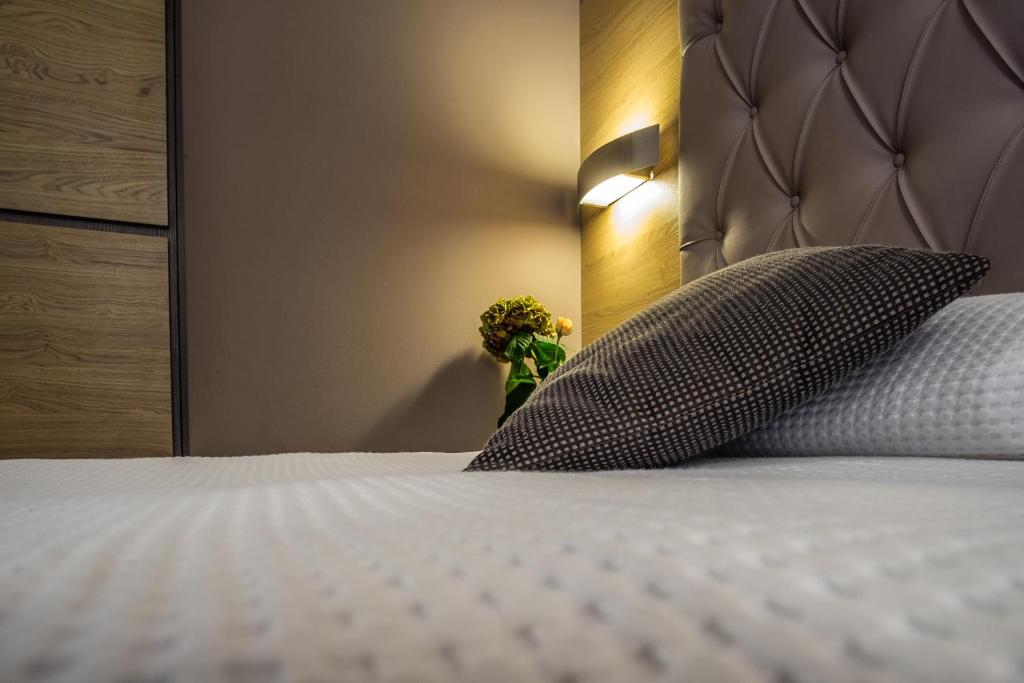 Postel nebo postele na pokoji v ubytování Hotel Residence Ristorante Ramandolo