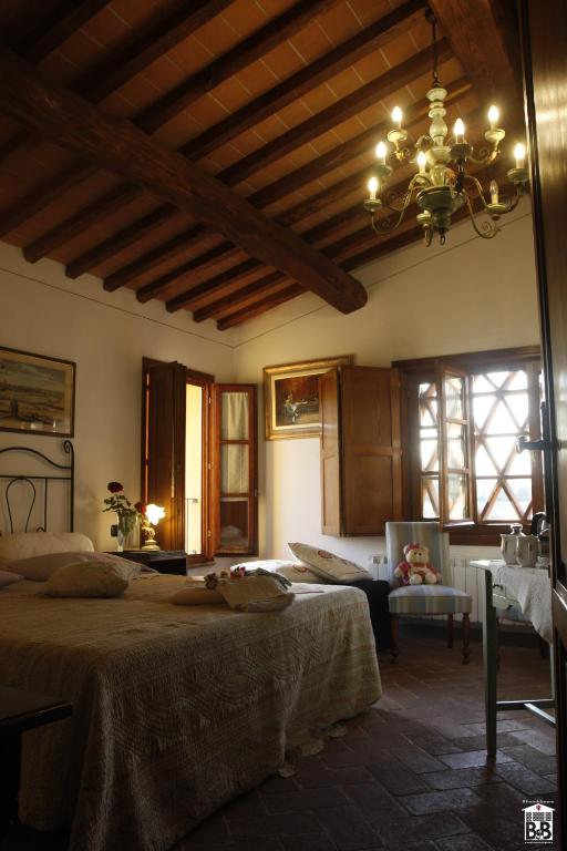 Łóżko lub łóżka w pokoju w obiekcie B&B il Fienile di Scarperia
