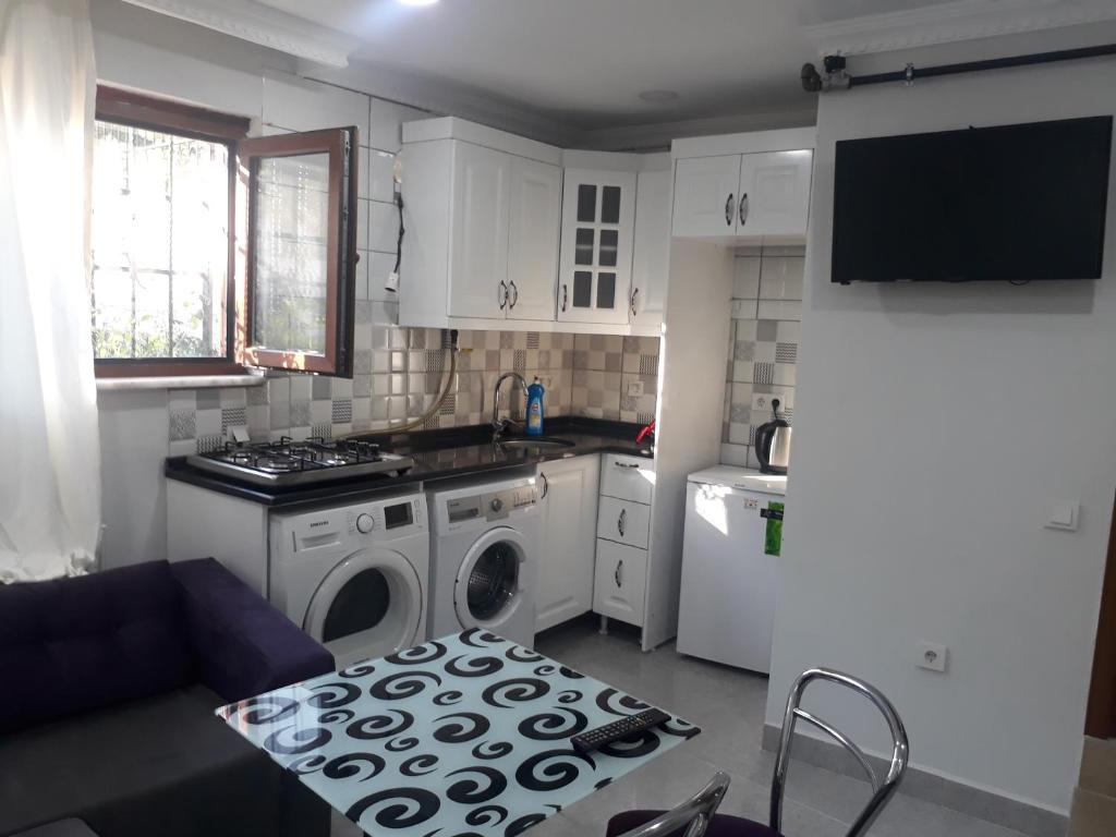 Kuchyň nebo kuchyňský kout v ubytování Arat Apartments