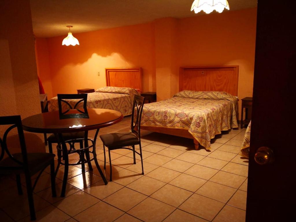 Postel nebo postele na pokoji v ubytování Hotel del Conde