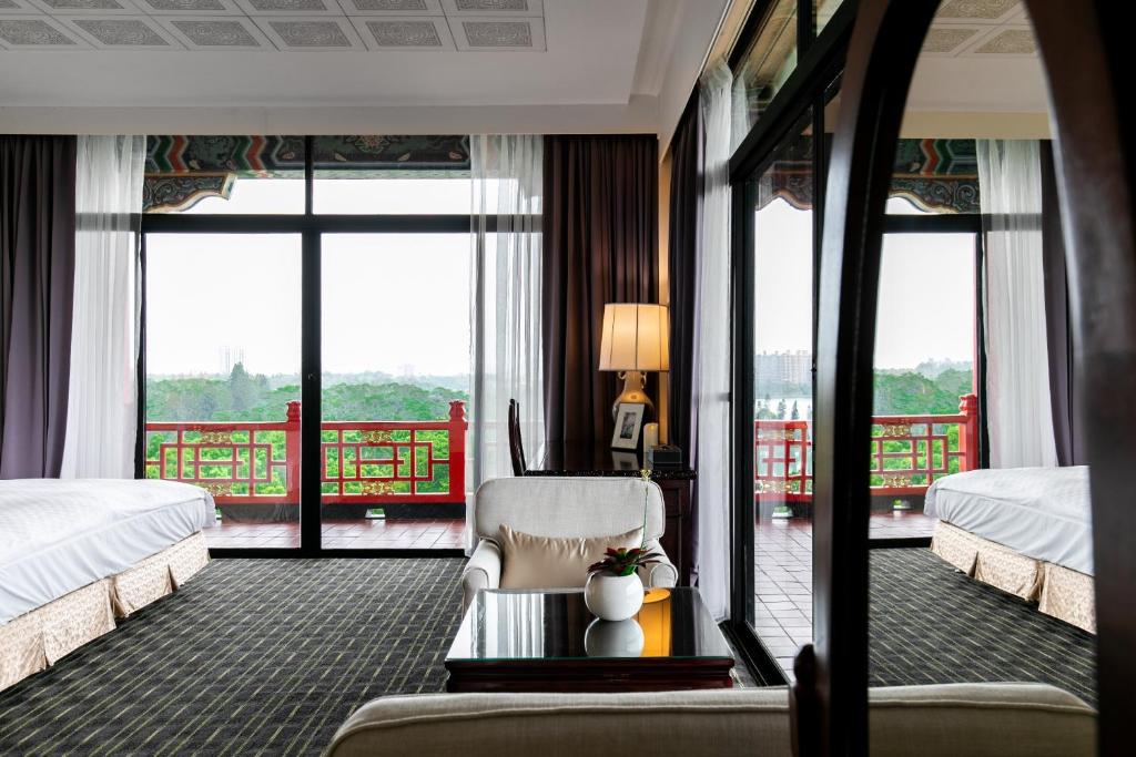 Postel nebo postele na pokoji v ubytování The Grand Hotel Kaohsiung