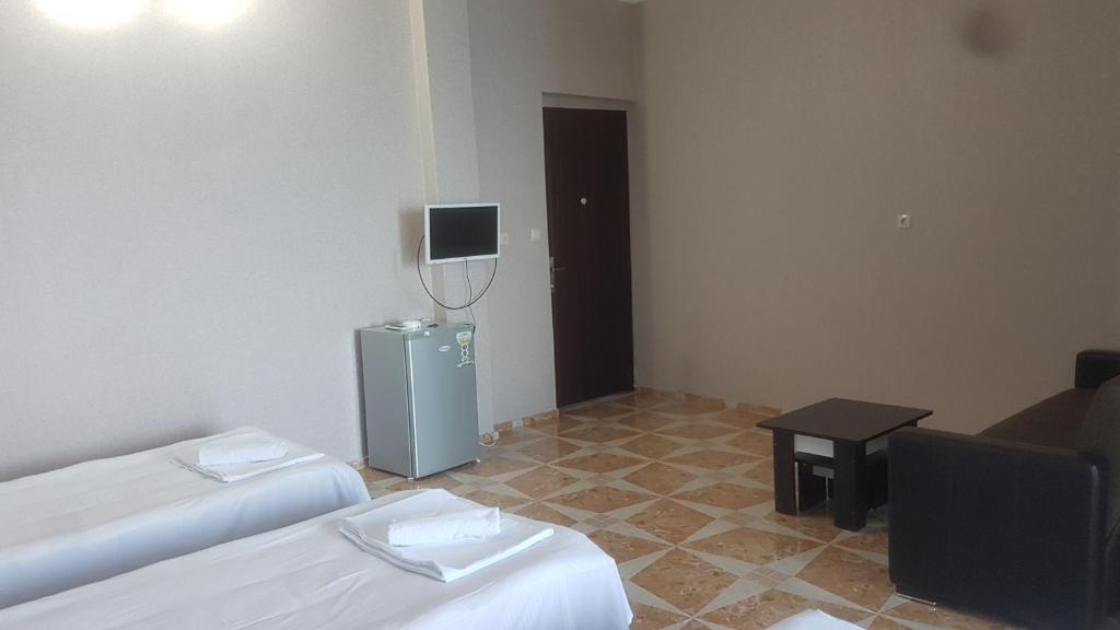 TV a/nebo společenská místnost v ubytování Hotel Kvariati Nugo