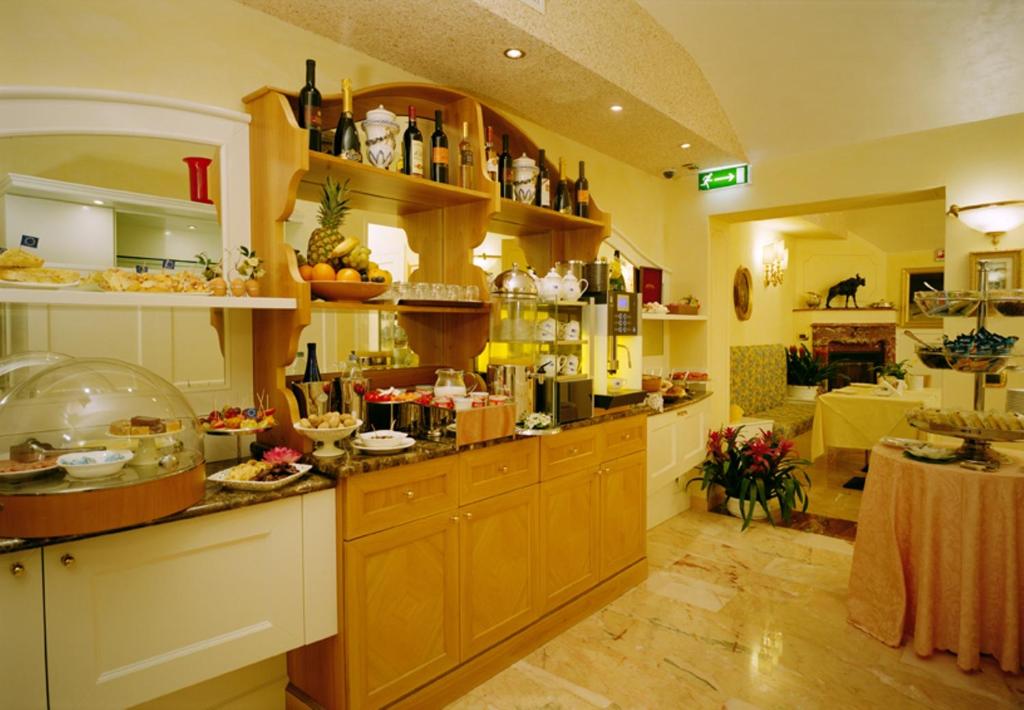 Kuchyň nebo kuchyňský kout v ubytování Boutique Hotel Dieci