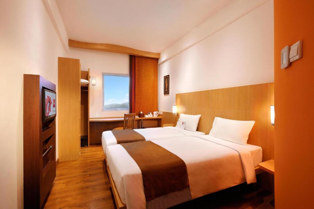Postel nebo postele na pokoji v ubytování Ibis Bali Kuta