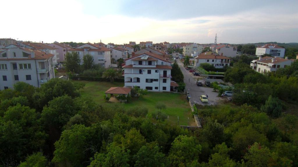 an aerial view of a city with houses and trees at Apartments Ana in Rovinj