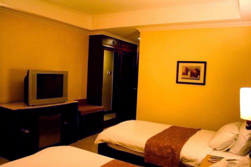 Postel nebo postele na pokoji v ubytování MO2 Westown Hotel - Mandalagan
