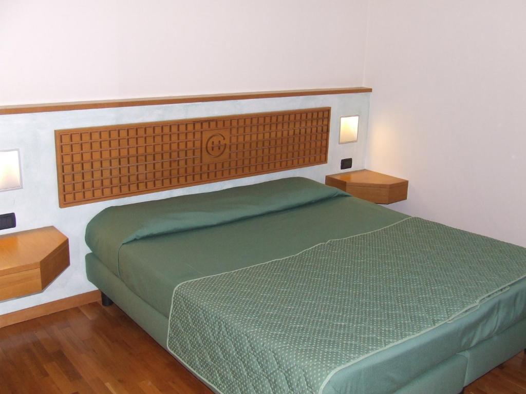 Postel nebo postele na pokoji v ubytování Hotel Ghibellino