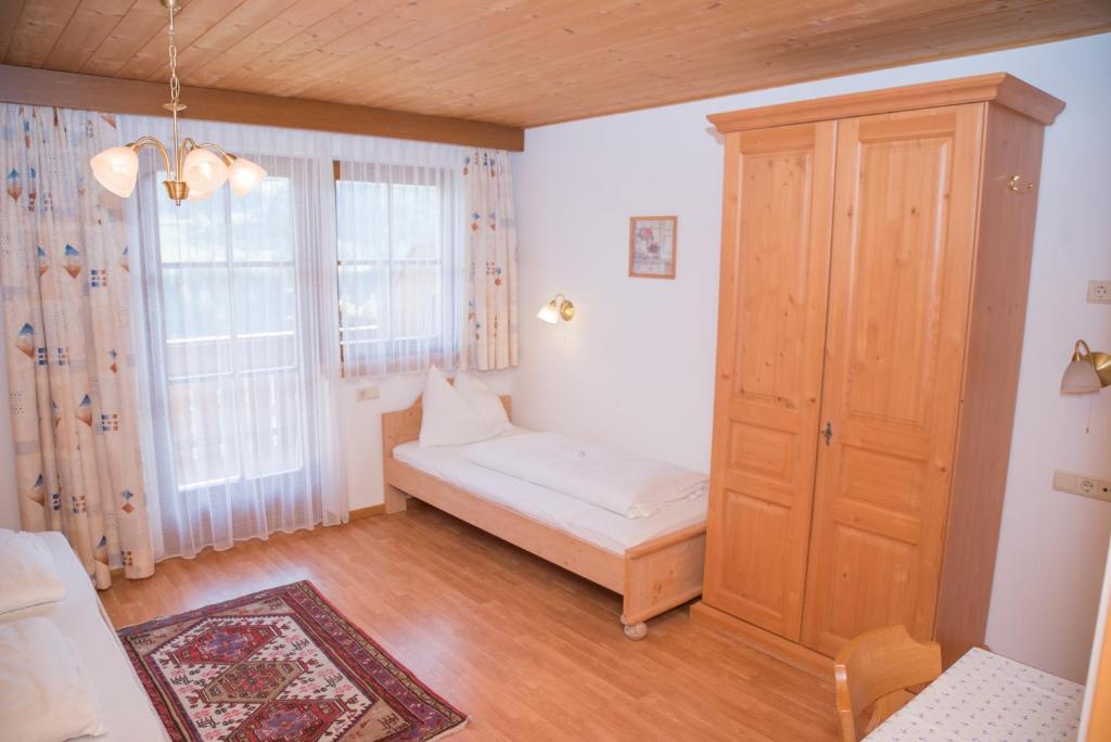 Postel nebo postele na pokoji v ubytování Stegerhof