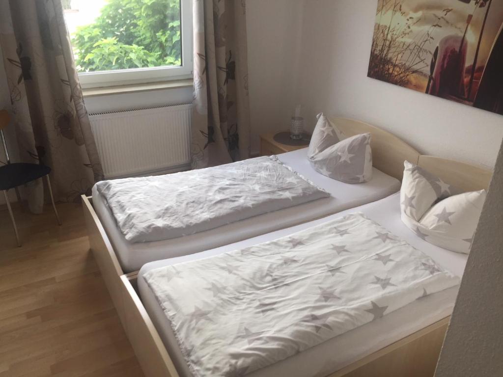 Postel nebo postele na pokoji v ubytování Hotel Maxdorfer Hof