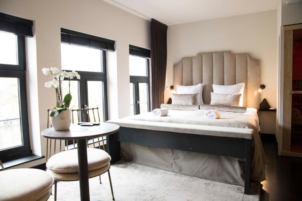 Cama o camas de una habitación en House of Amstel