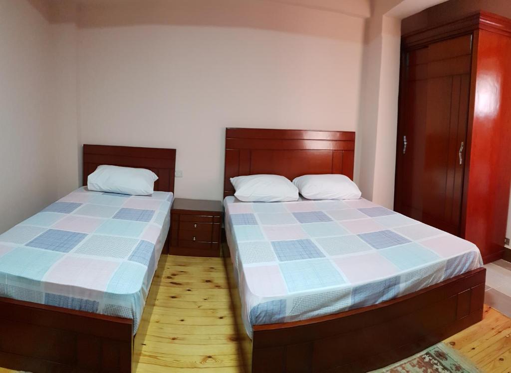 Postel nebo postele na pokoji v ubytování Caesar House
