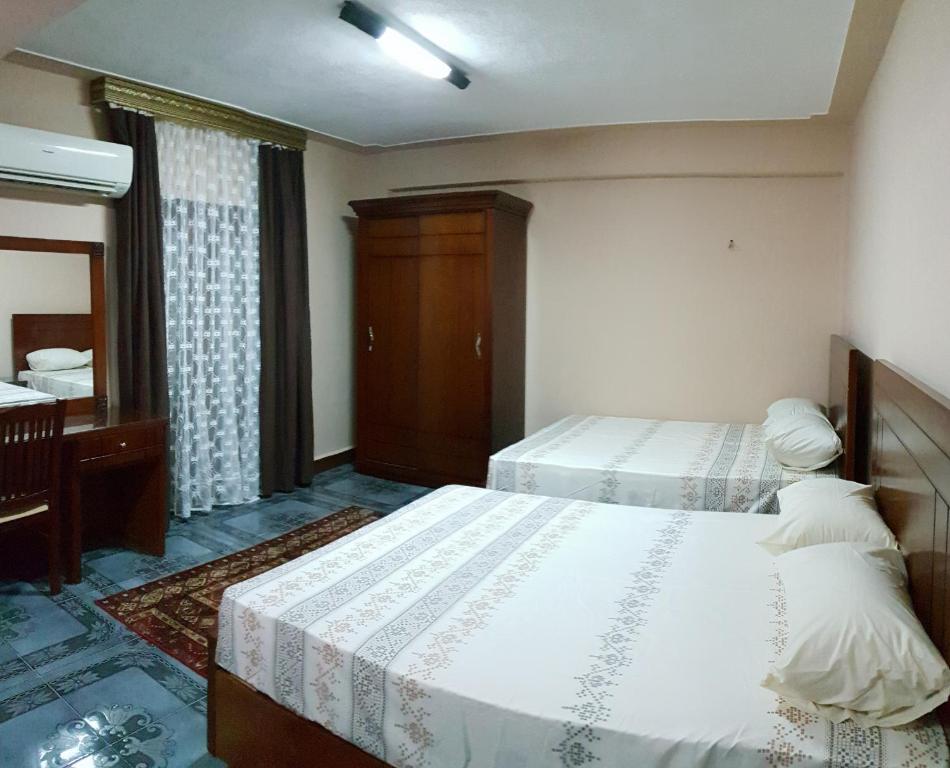 Postel nebo postele na pokoji v ubytování Caesar House
